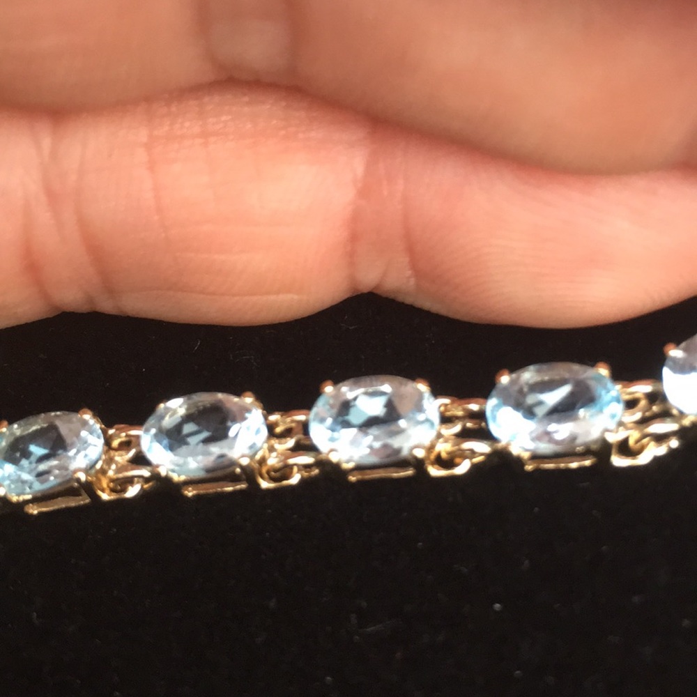 Genuine aquamarine tennis bracelet.